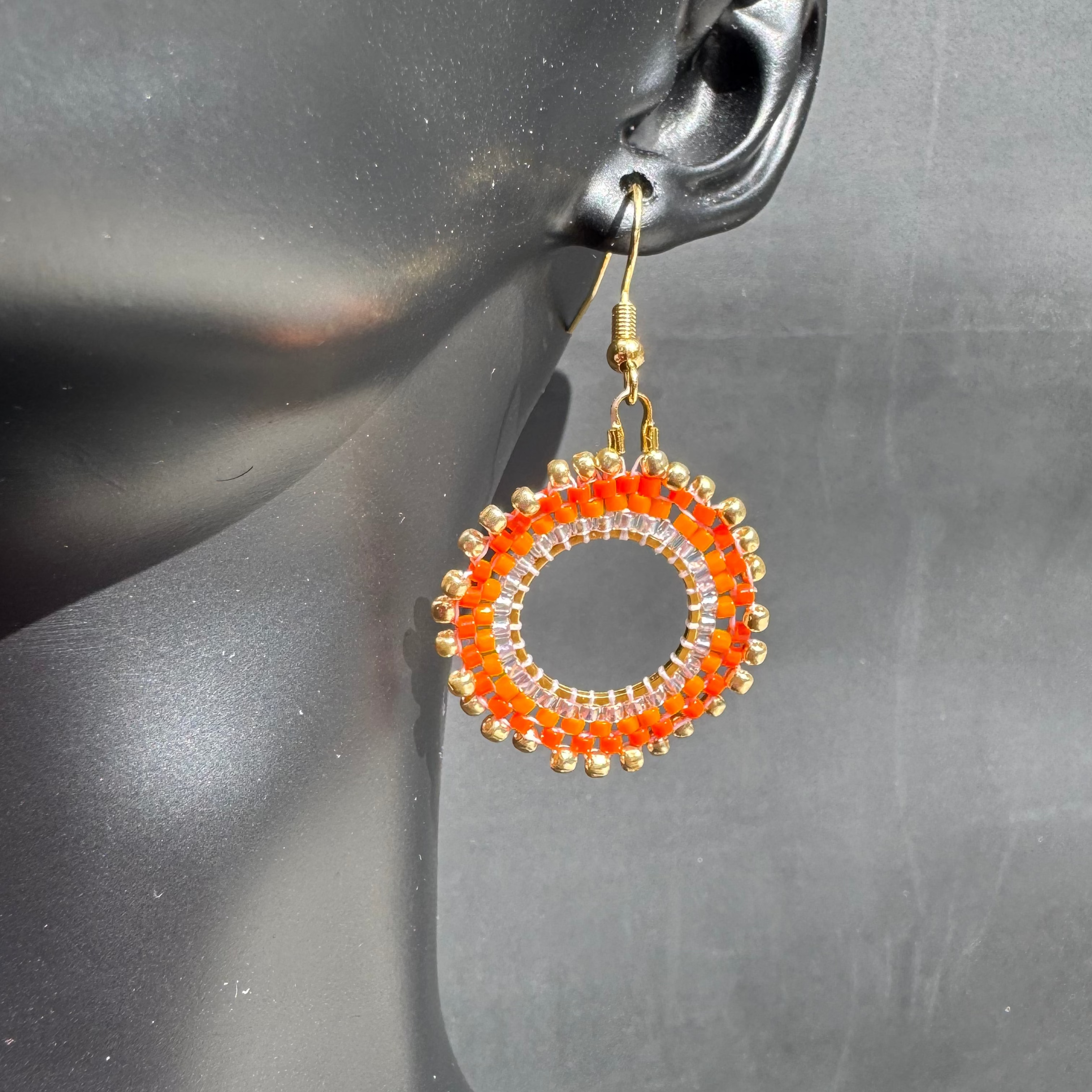 The Oshun Earrings in "Carrot Cake"